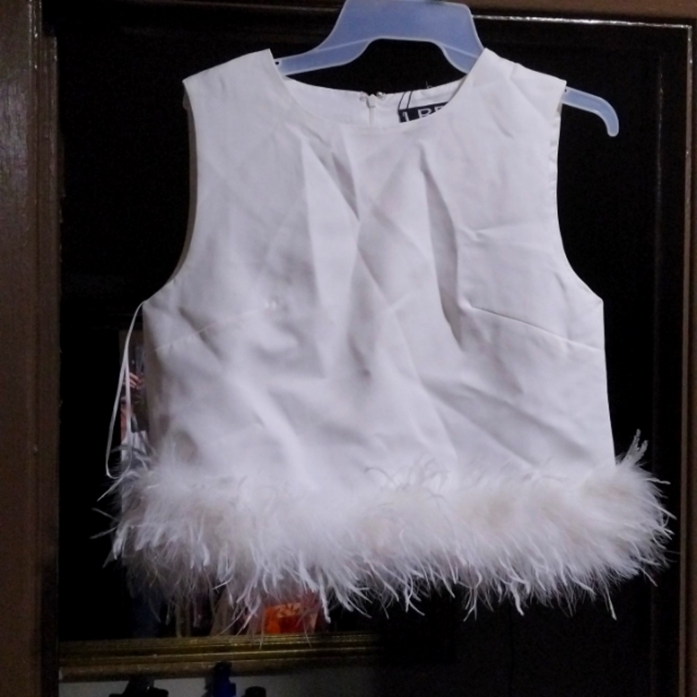 Off white sleeveless top with fur around the bottom